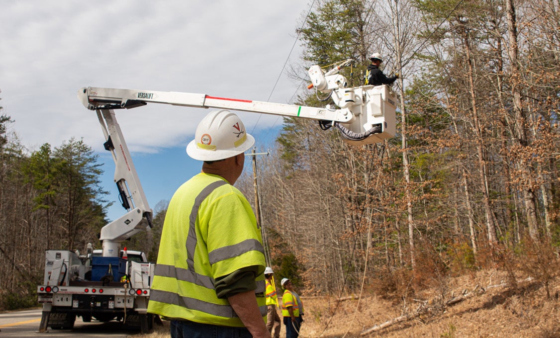 lineman watching lineman in bucket truck